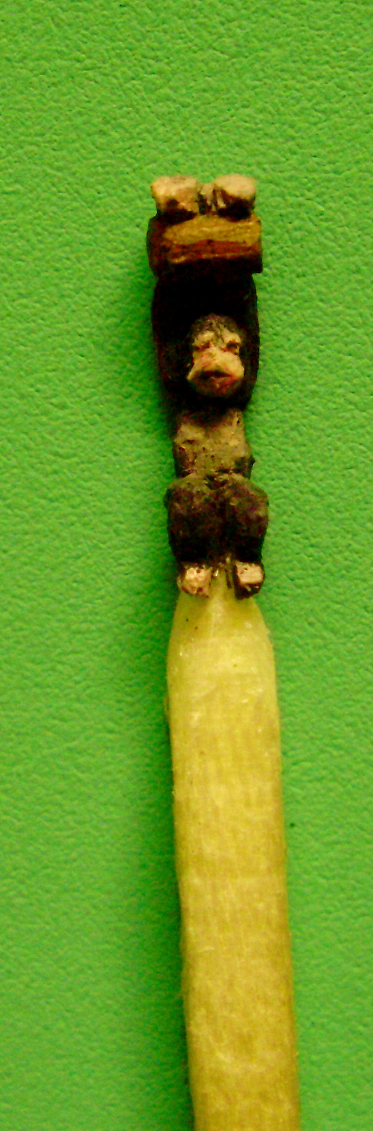 carved monkey matchstick